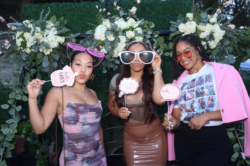 Guests posing inside the Lumia DSLR photo booth at a wedding reception