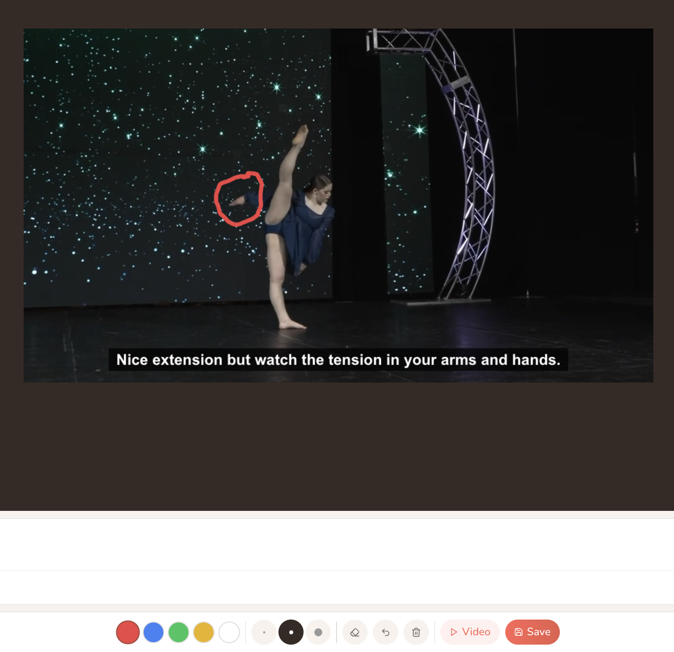 Annotated video frame with a sketched circle on the dancer's arm and a caption beneath