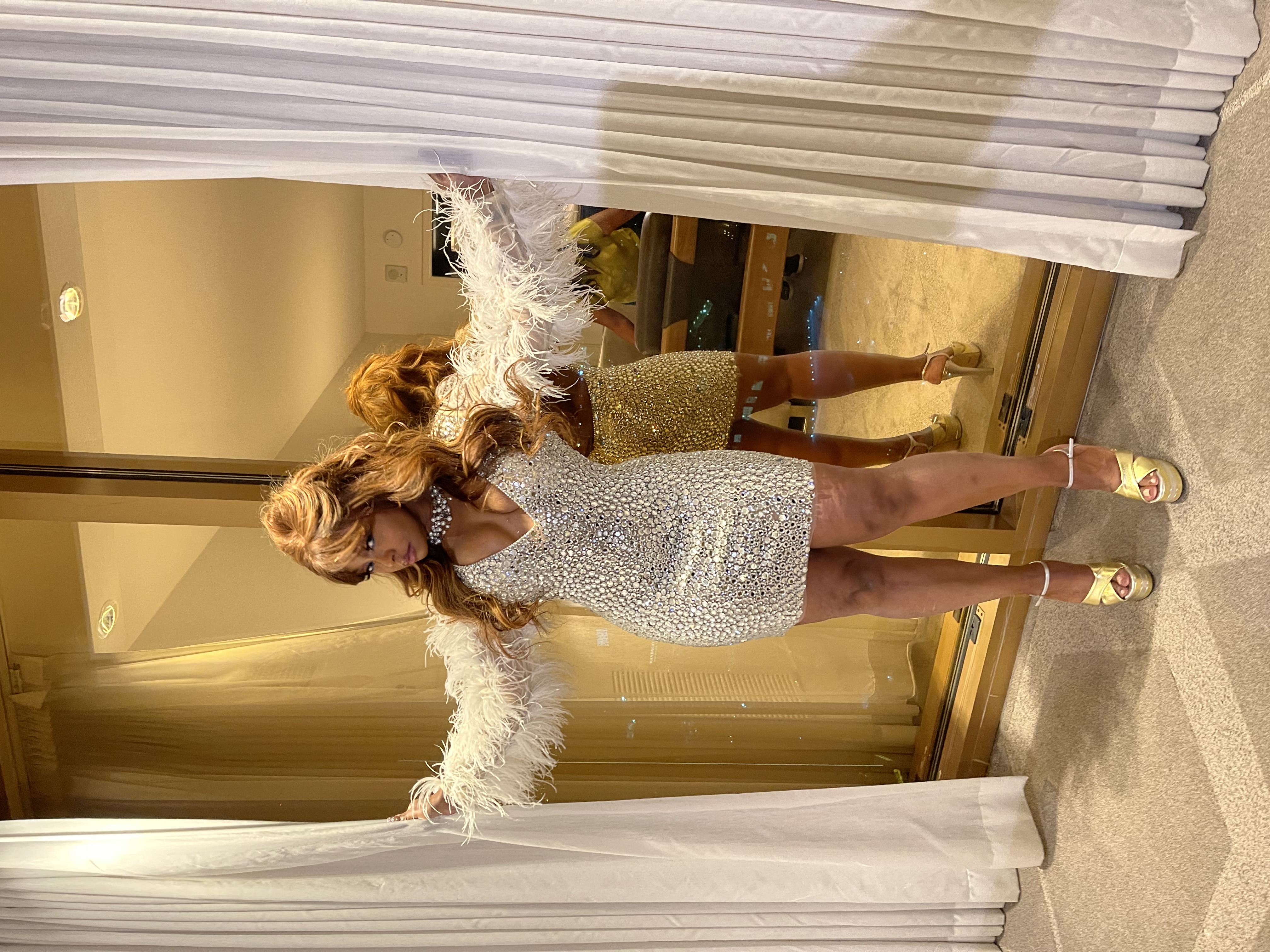 Phaedra Parks in her Jovani 08306 crystal-covered mini dress with ostrich feather cuffs at BravoCon 2023
