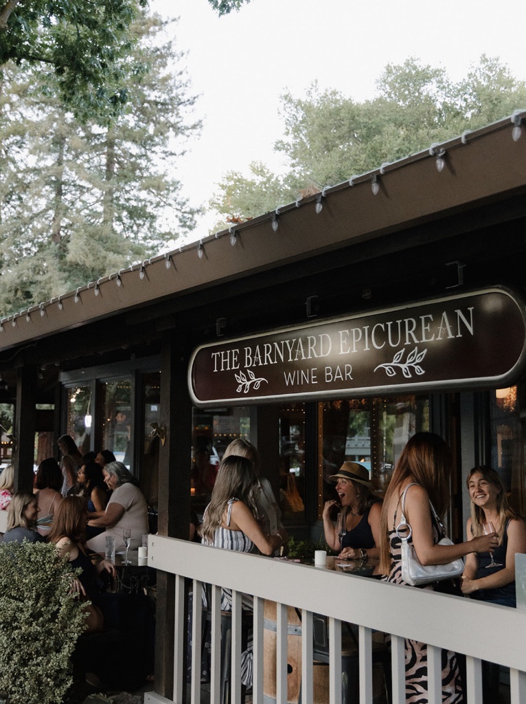 Women gathering at the Barnyard Epicurean Wine Bar