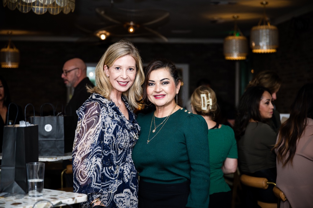 Two women enjoying a community event together