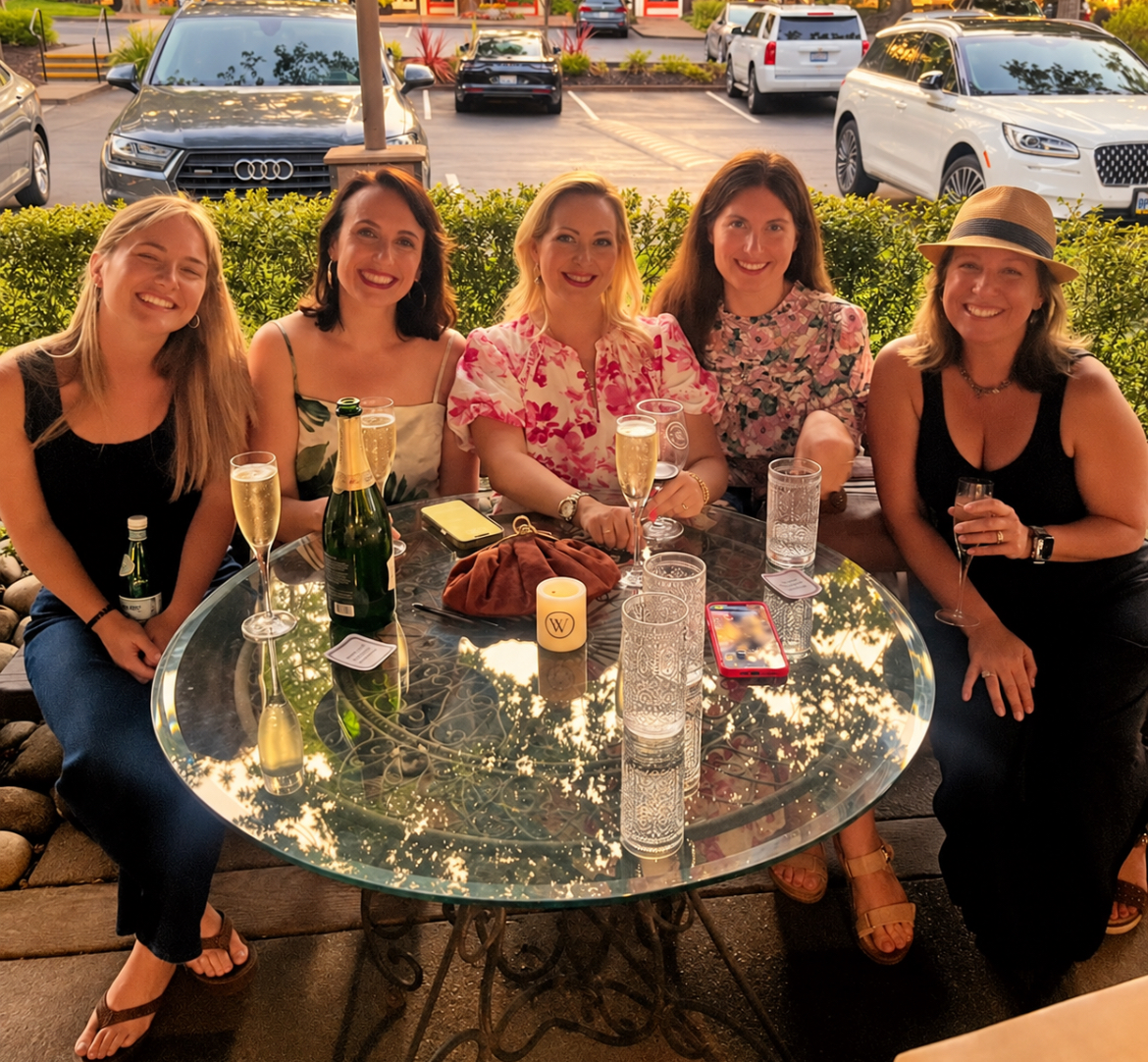 Five women gathered around a table at a She Connects event