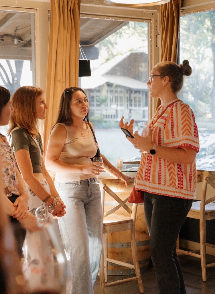 Women laughing and connecting at a community gathering