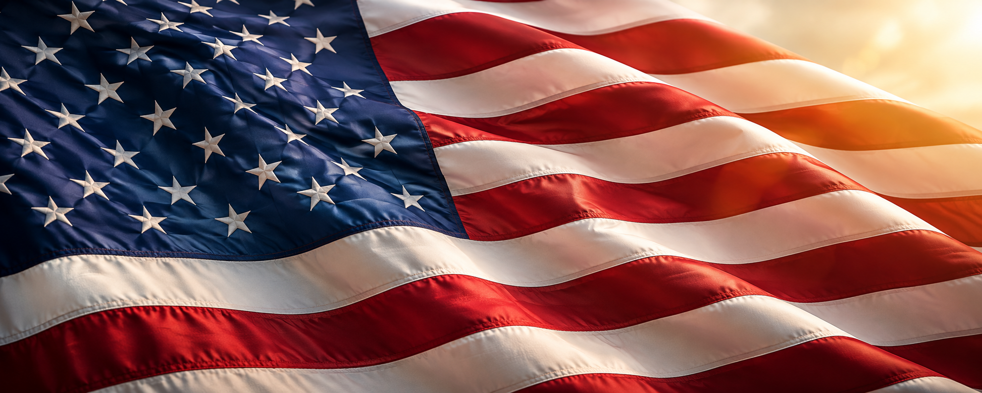 American flag waving in the wind at golden hour