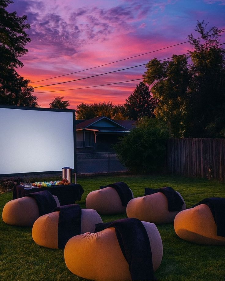 Outdoor backyard cinema setup at night
