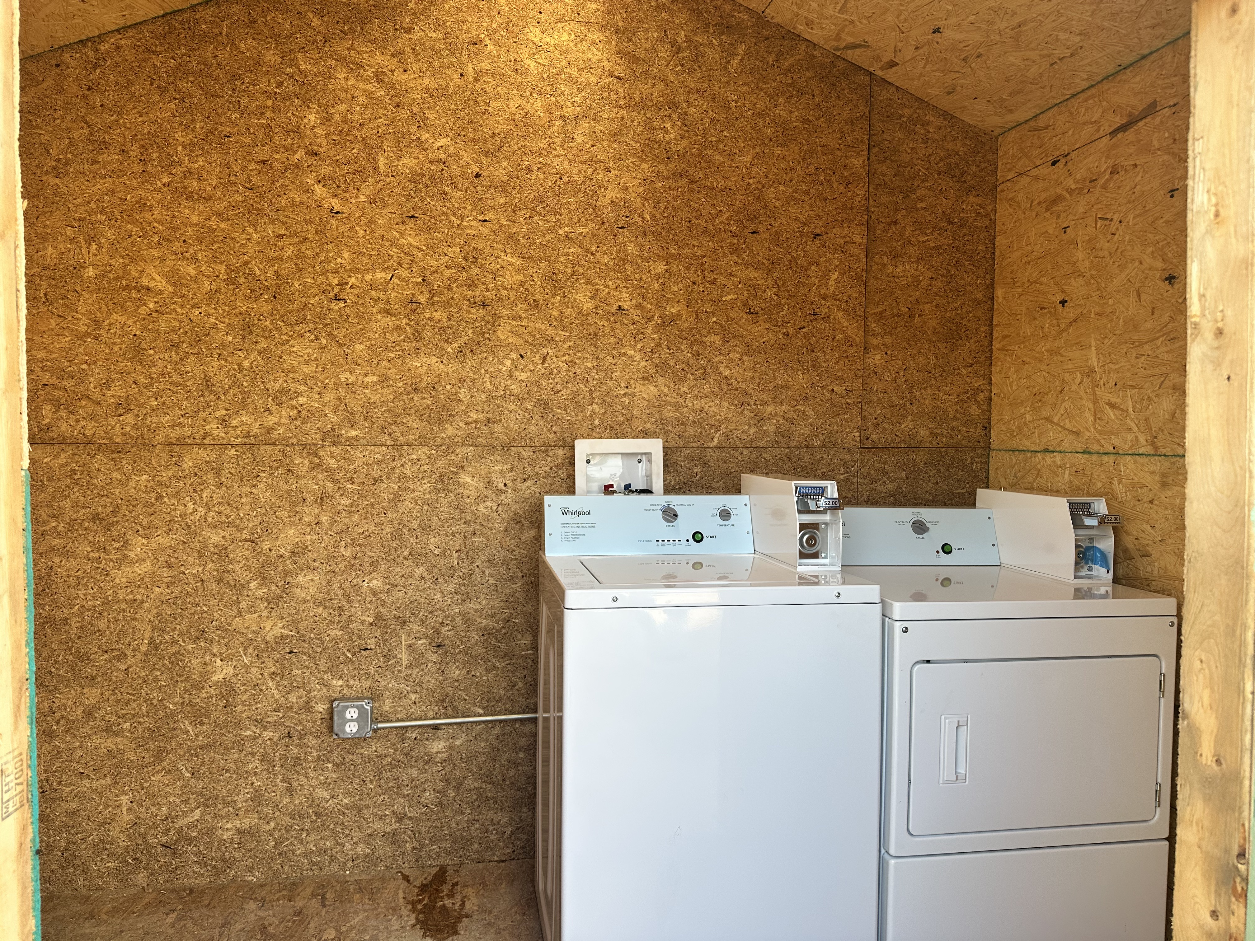 Coin-operated washer and dryer in the laundry room
