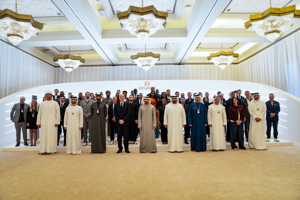 FGSL delegation on stage at a formal international sports summit event