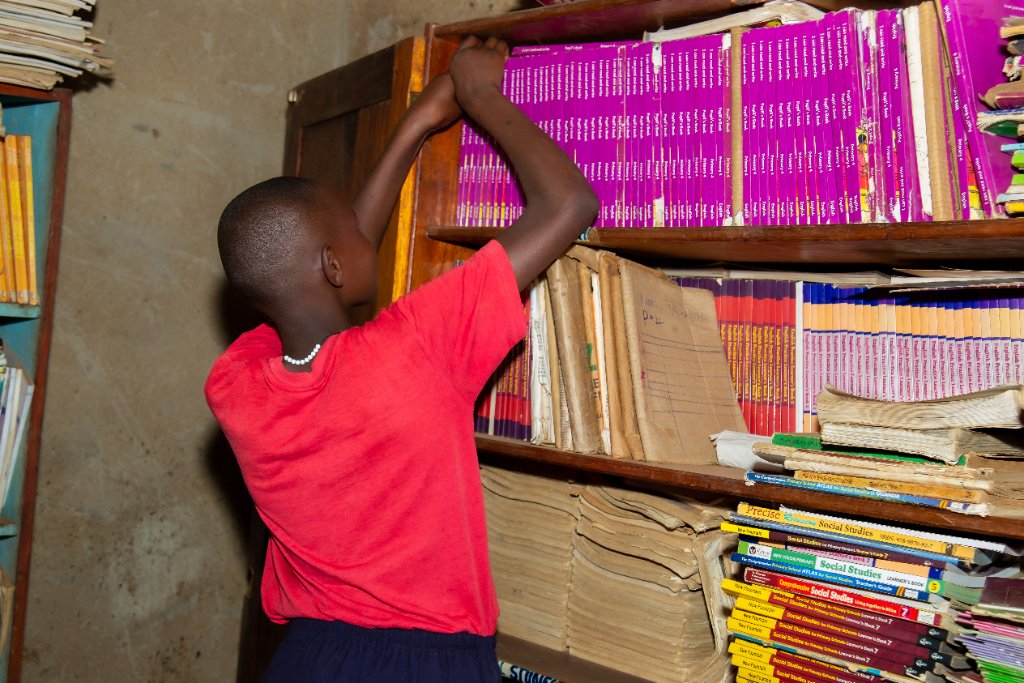 Student shelving new books
