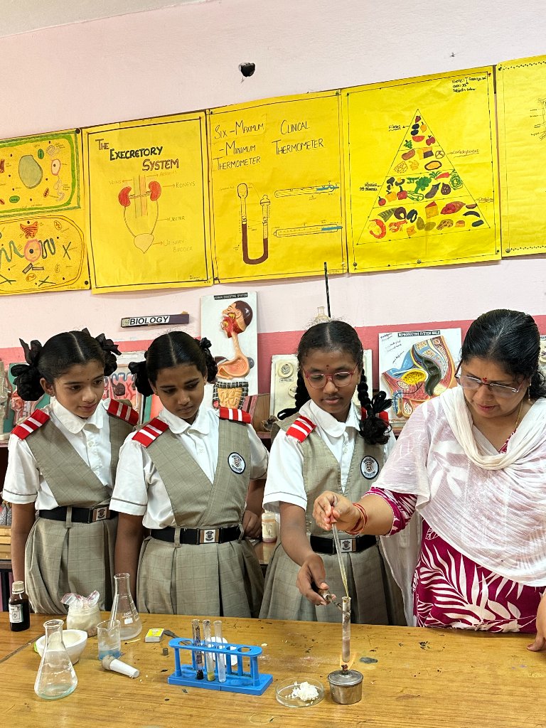 Students conducting a chemistry experiment with guidance