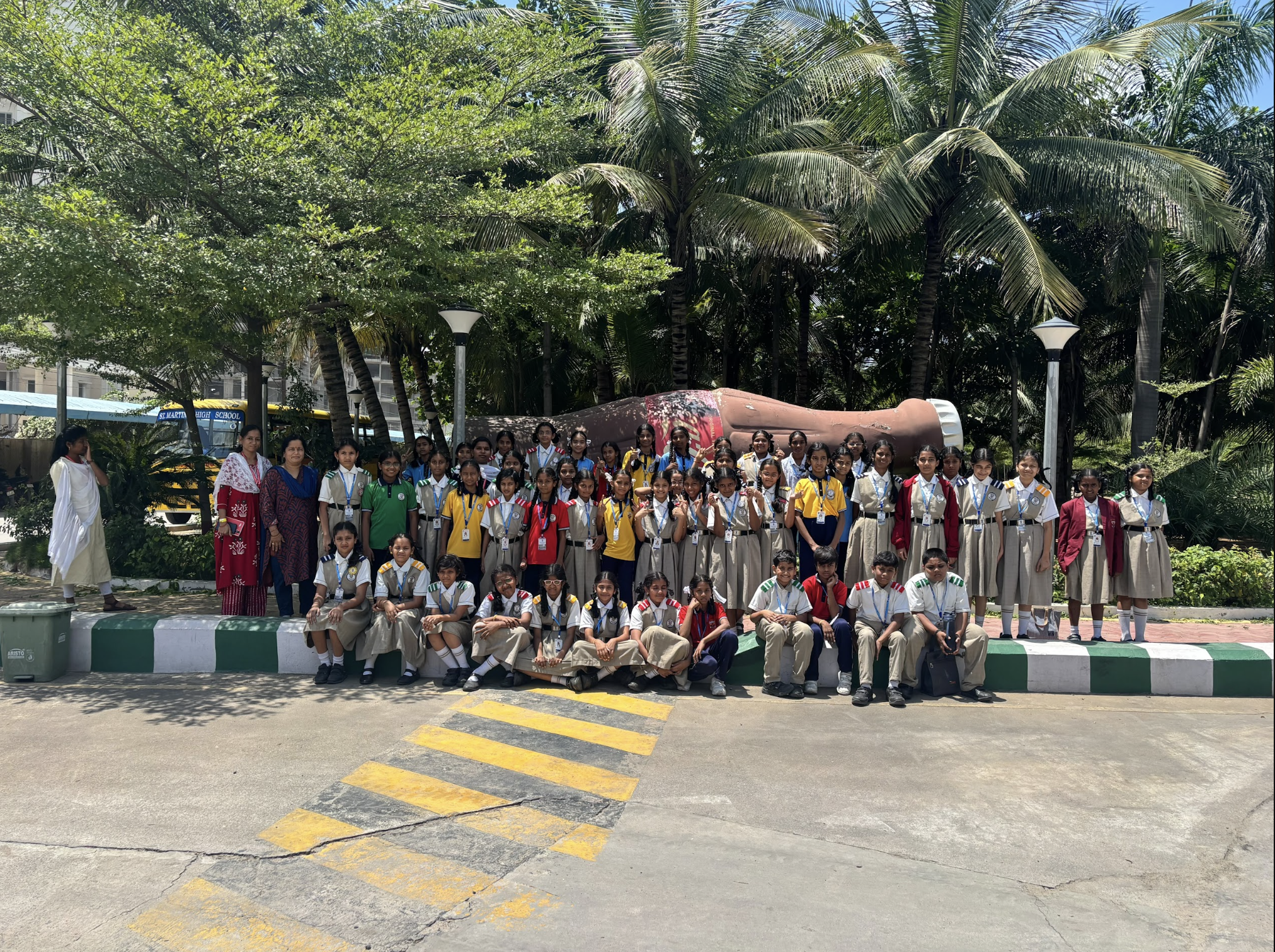 Coca-Cola Field Trip — Group Pose Outdoors with the Bottle Sculpture