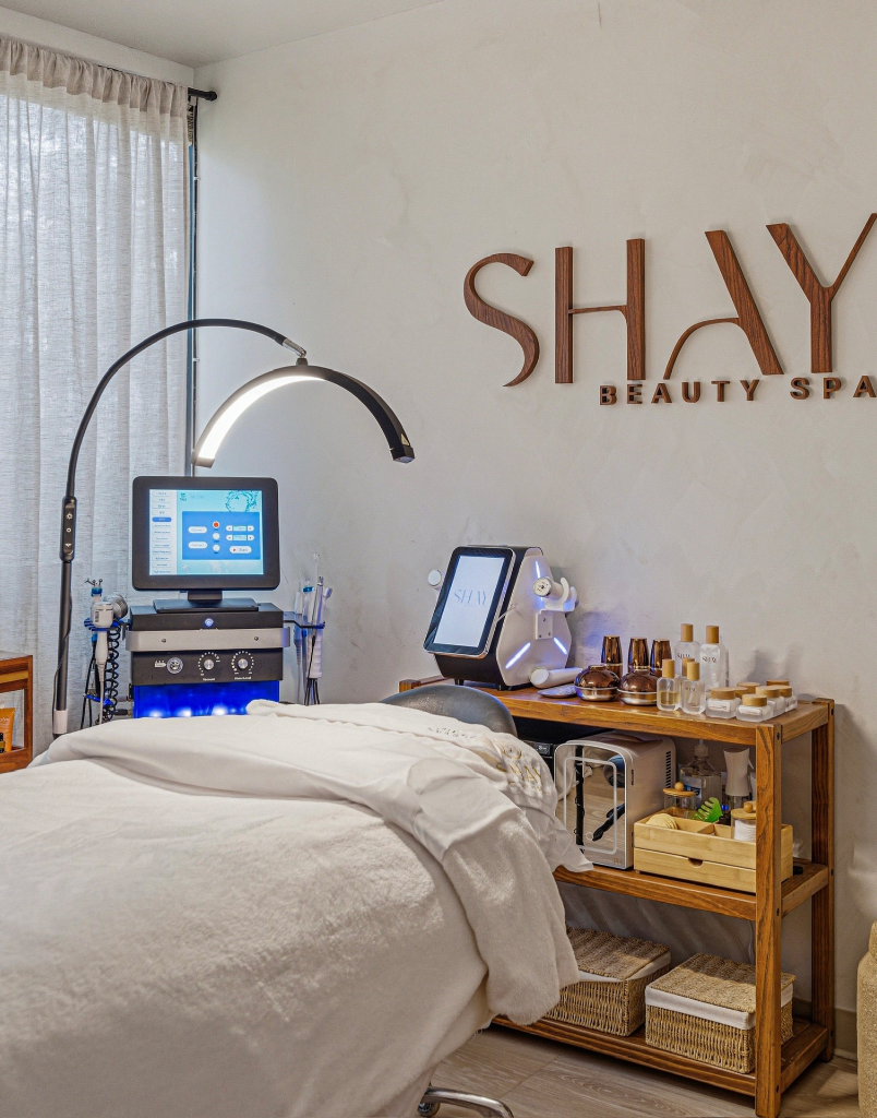 Shay Beauty Spa treatment room with adjustable bed and examination lamp