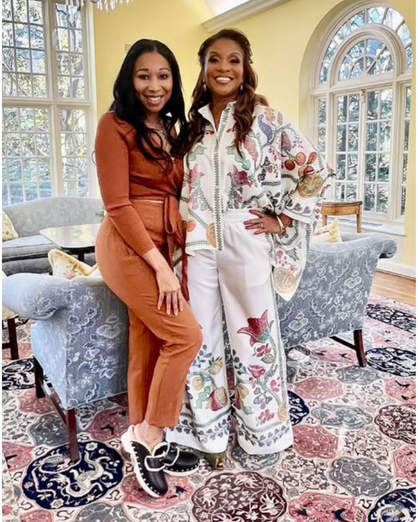 Angelique Michelle with a friend in a sunlit room