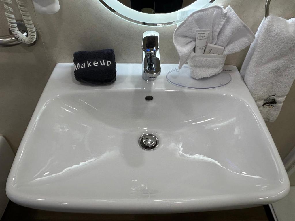 Vanity sink with amenities inside a dome
