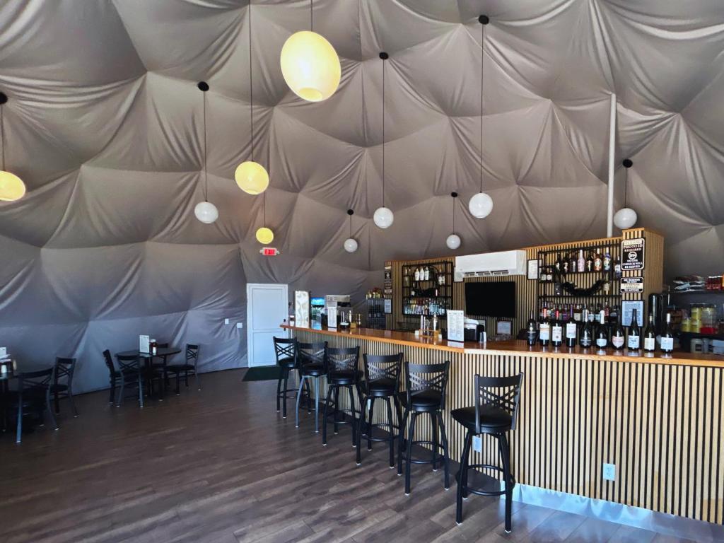 Bar and seating area inside the Entertainment Dome