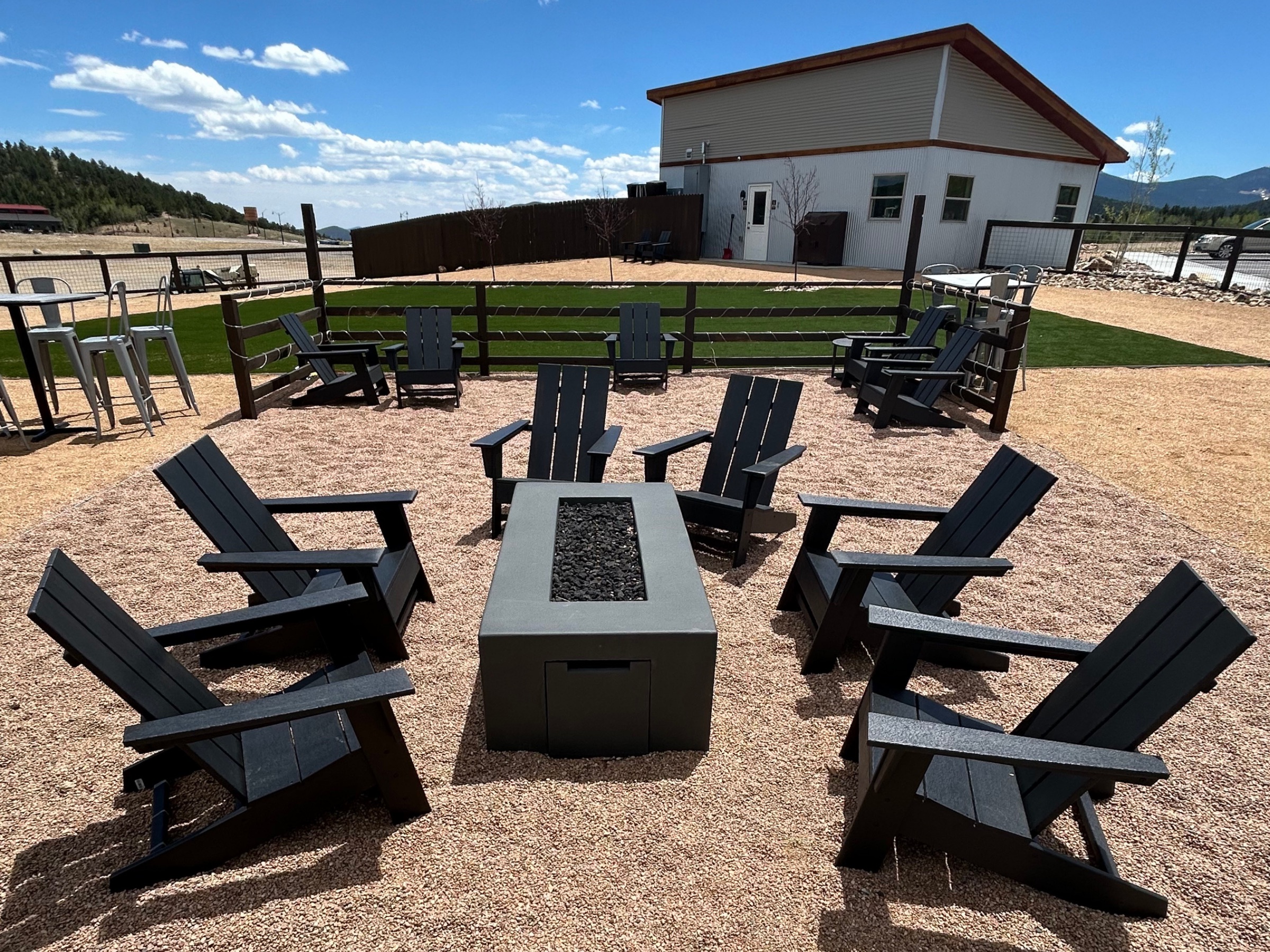 Fire pit and Adirondack chairs on the patio at The Nest
