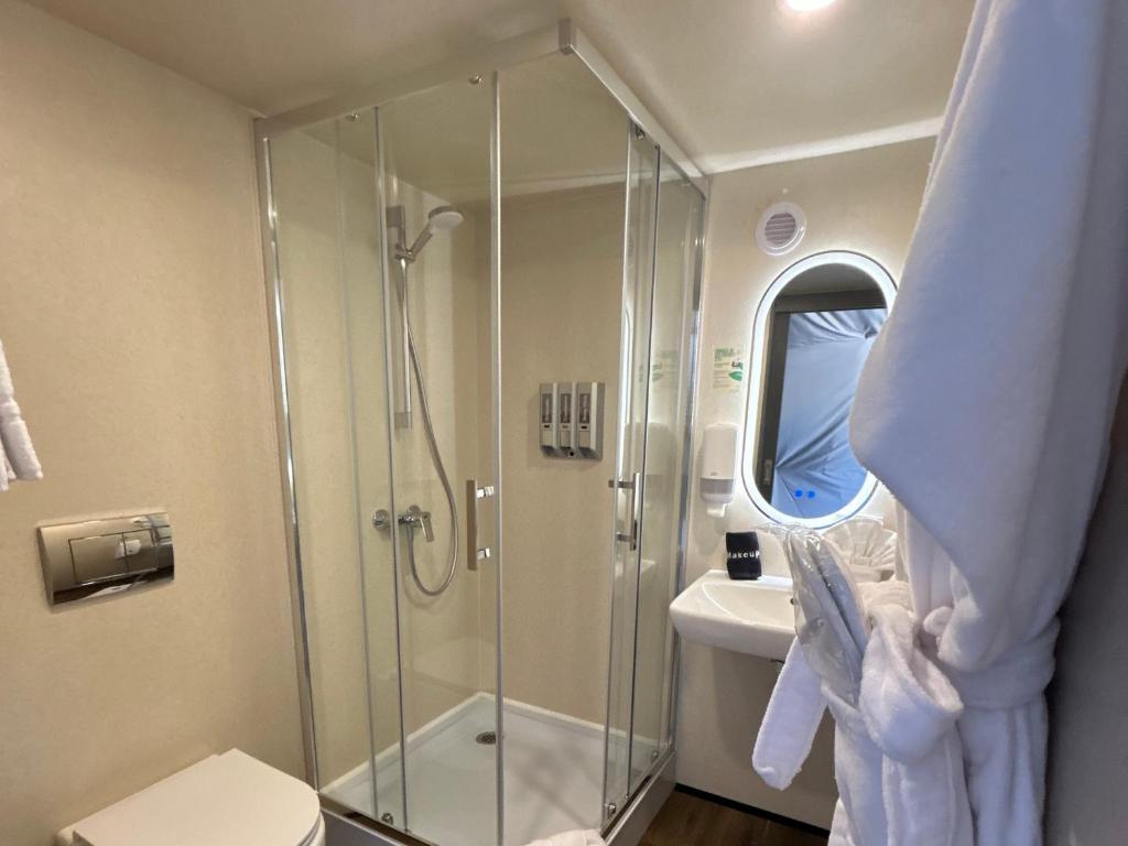 Bathroom shower and vanity inside a dome