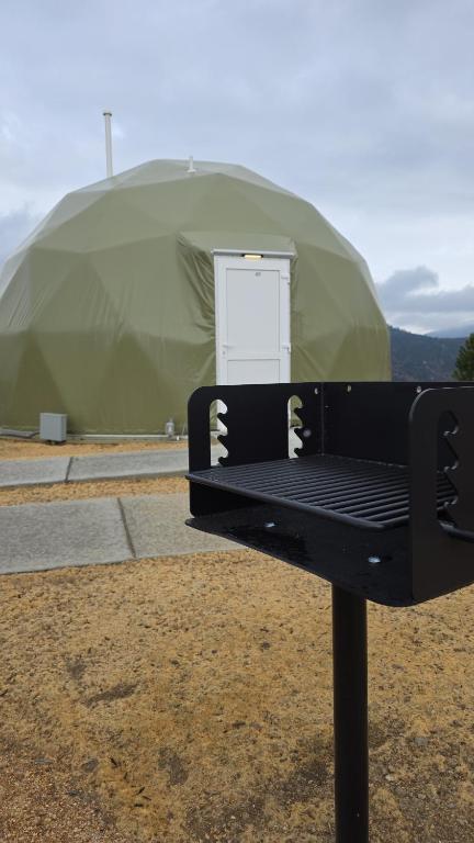 Outdoor grill and dome entrance at The Nest