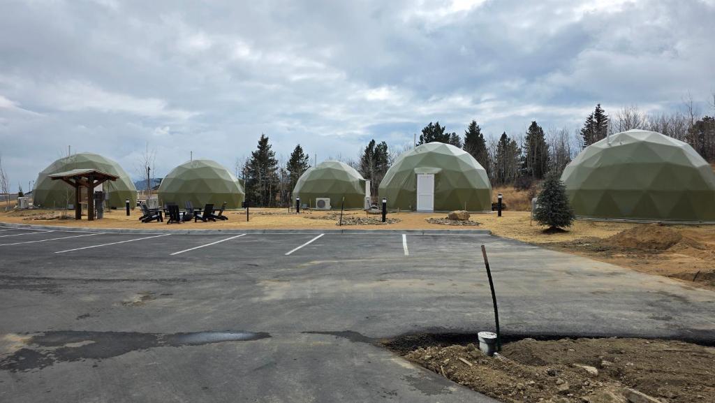 Parking lot and row of geodesic domes at The Nest