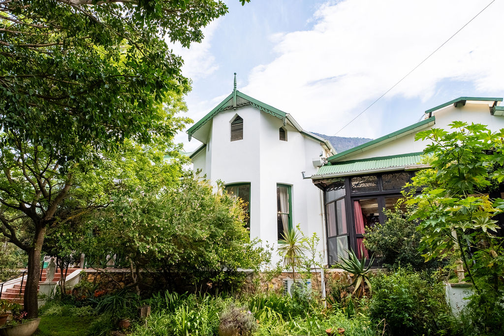 Riebeek Valley Hotel exterior nestled in lush gardens