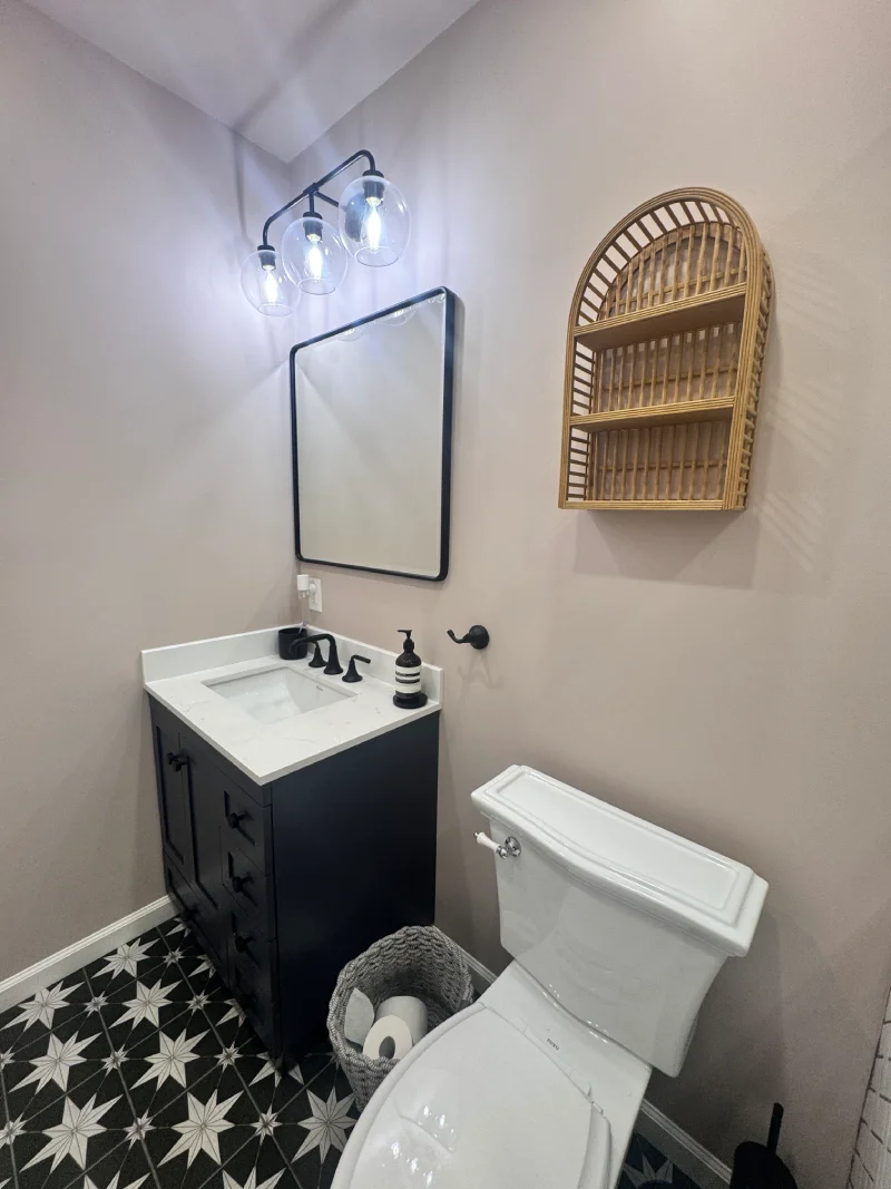 Powder room with patterned star tile floor