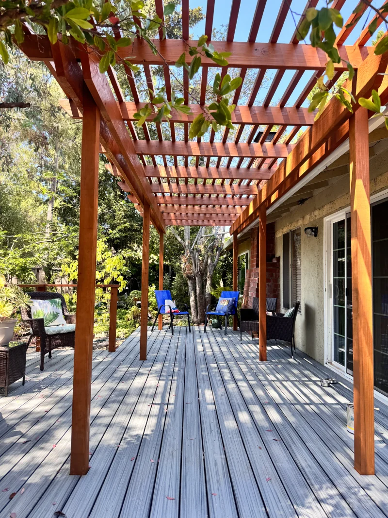 Custom pergola walkway along the back of a home