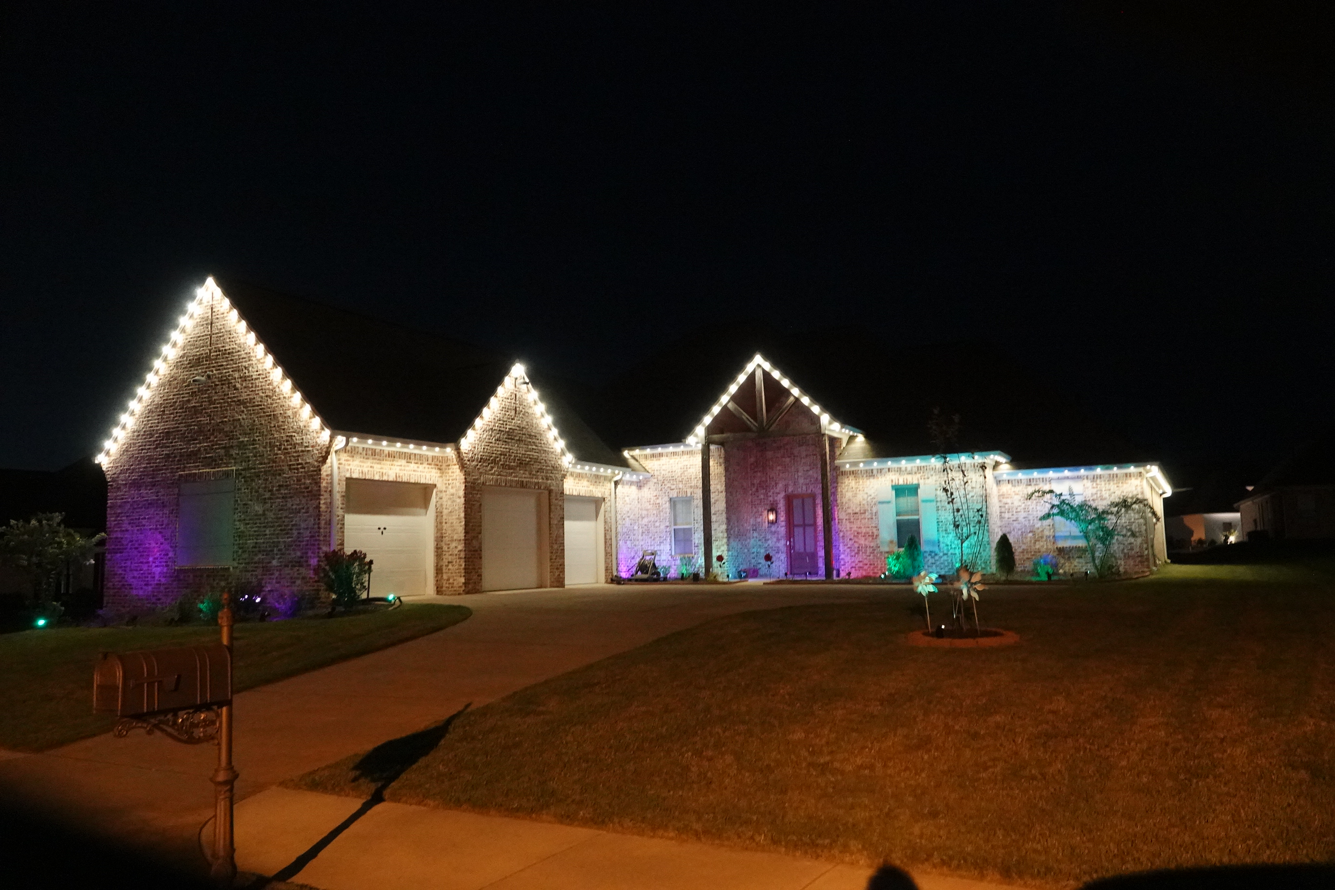 Brick home with purple and teal accent LED lighting