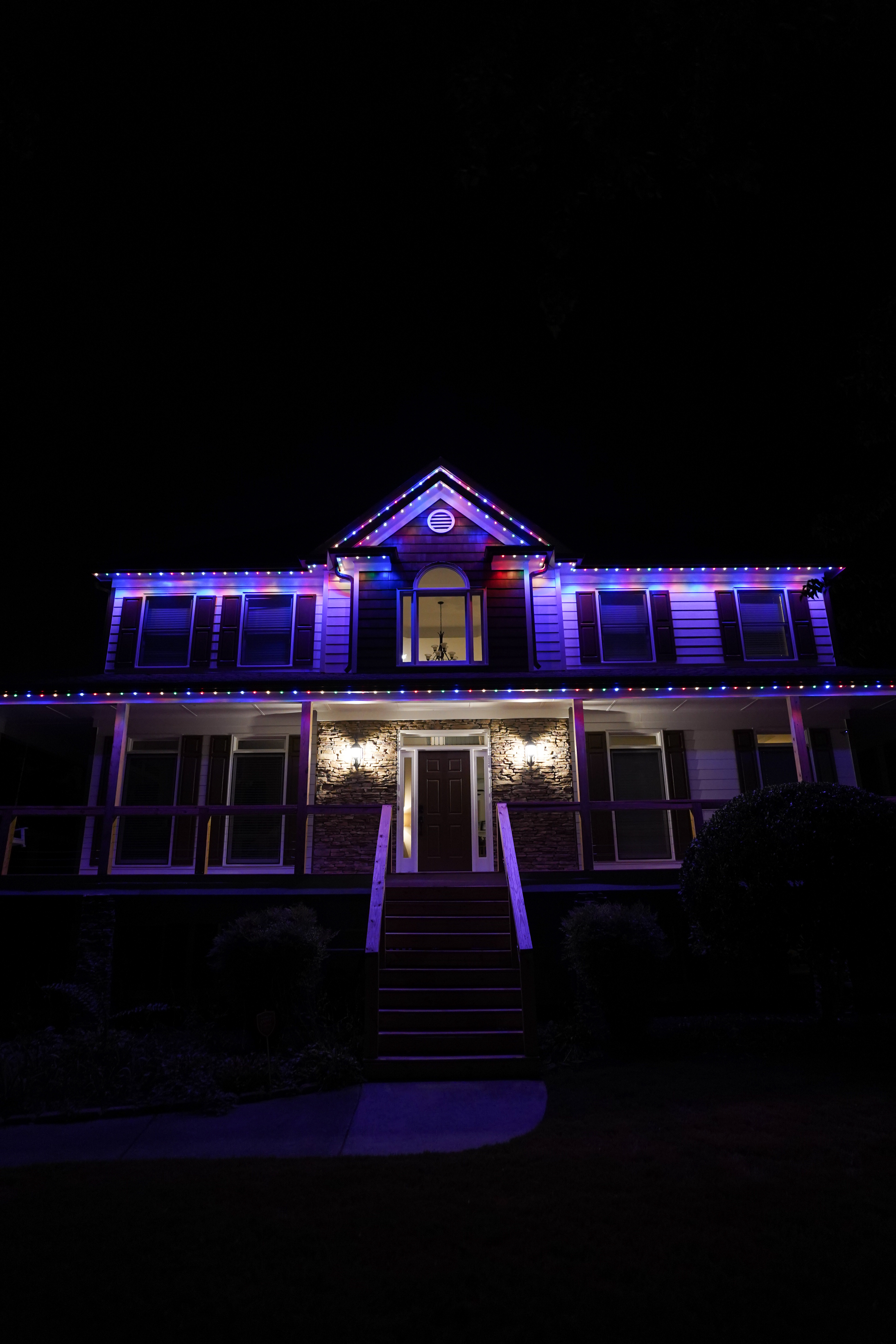 Home with colorful Christmas LED lighting