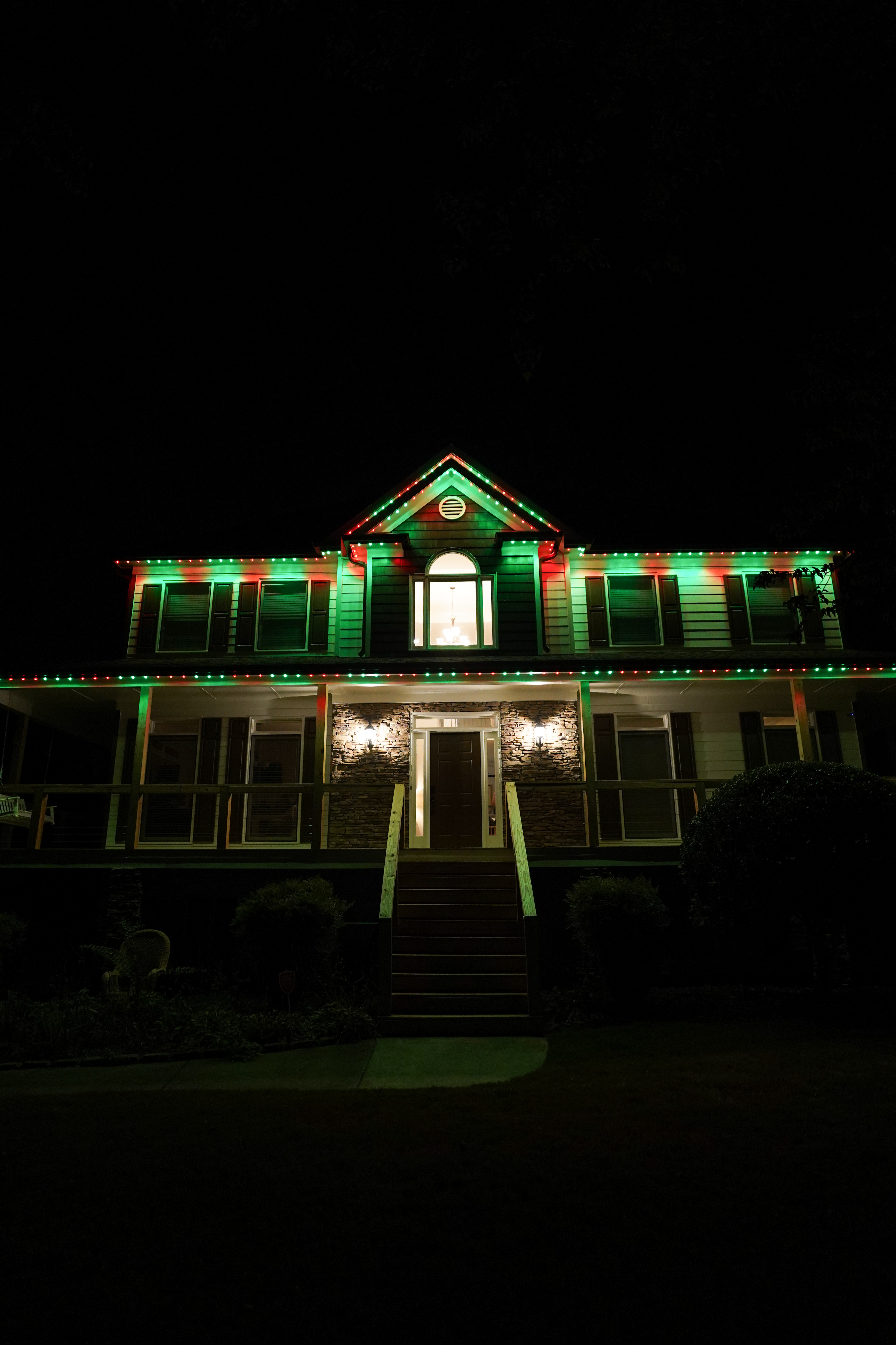 Home with red and green Christmas LED lighting