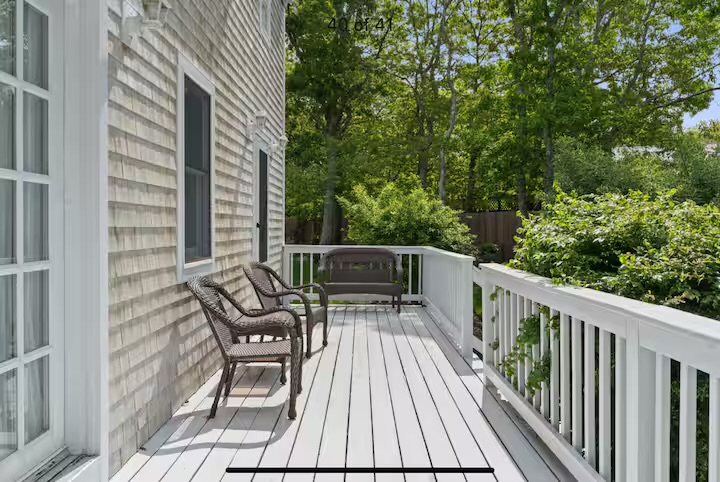 Guest house deck with seating at Summer Wind