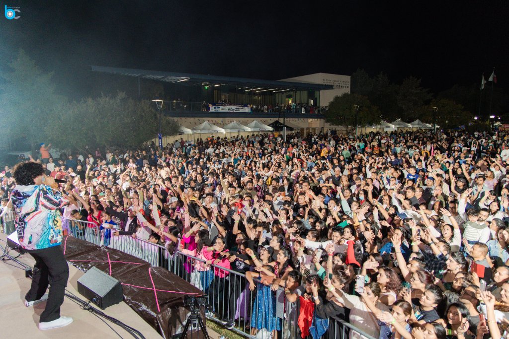 Crowd enjoying live performance at night