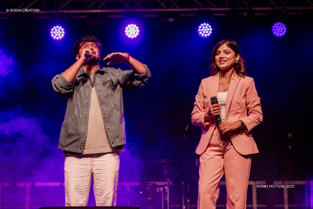 Duo performance under purple stage lights