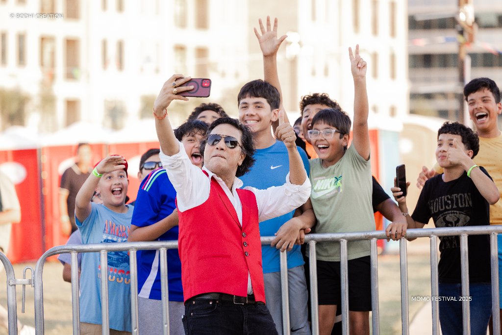Performer taking a selfie with the crowd