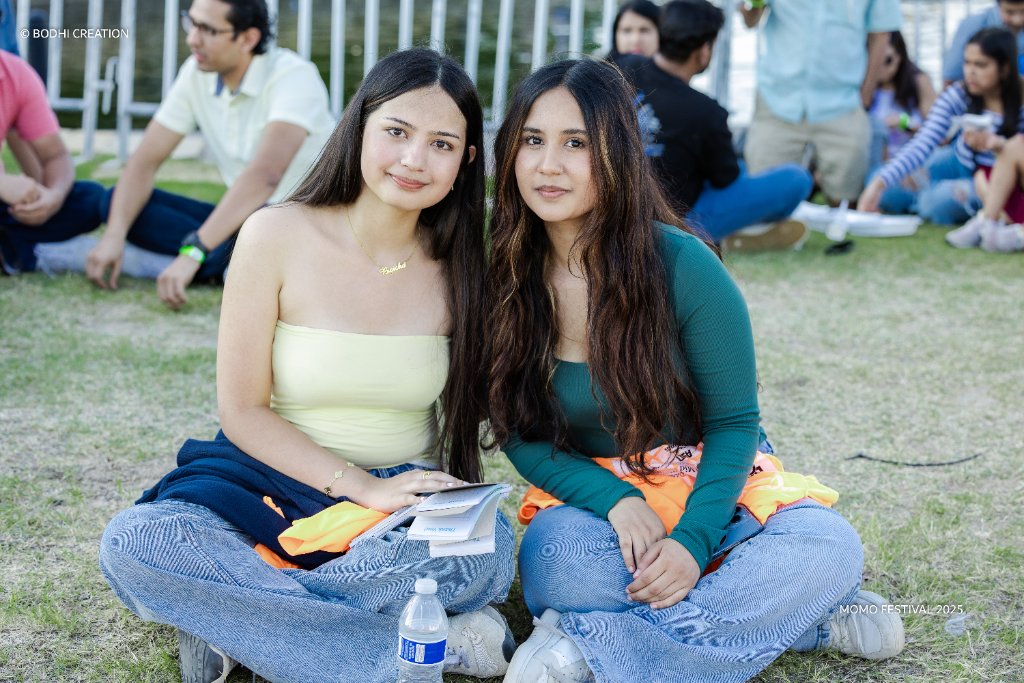 Festival-goers sitting together with drinks