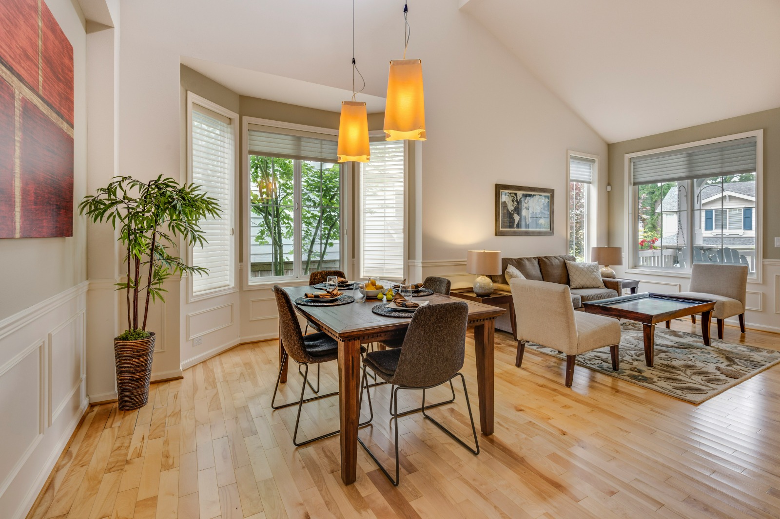 Open-concept living and dining area of Inna's renovated apartment in Portugal
