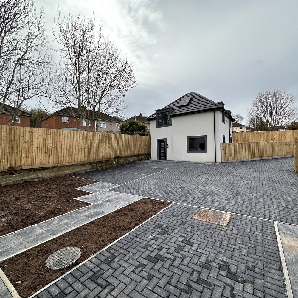 Detached dwelling with paved walkway to entrance.