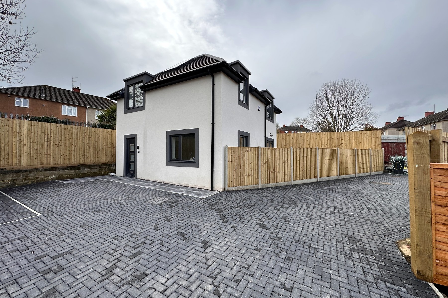 Side and front profile showing entrance and dormer.