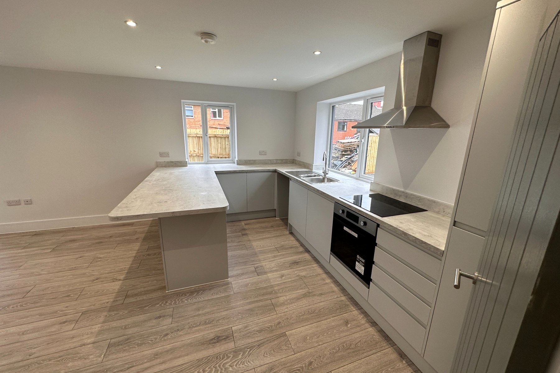 Contemporary fitted kitchen with integrated appliances.
