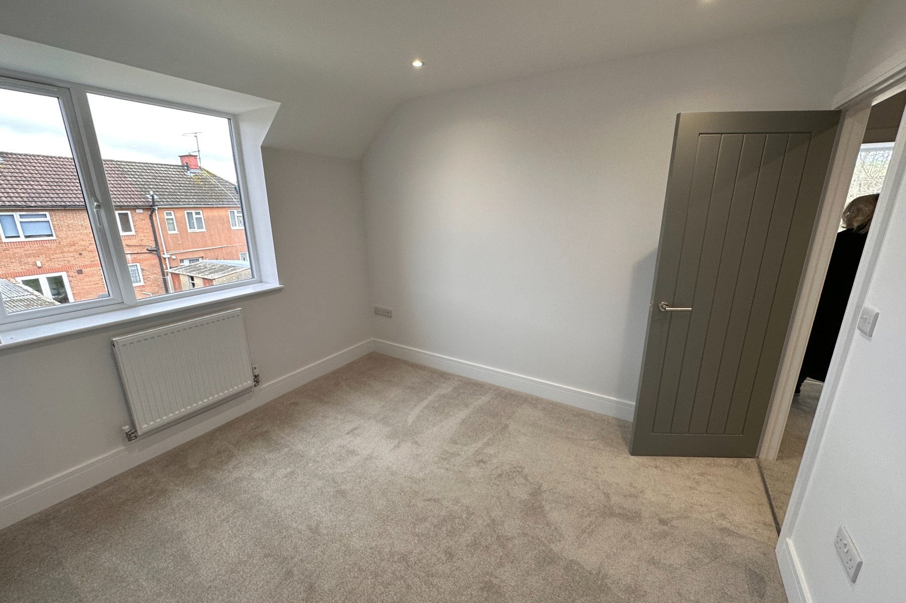 Bedroom with grey internal door.