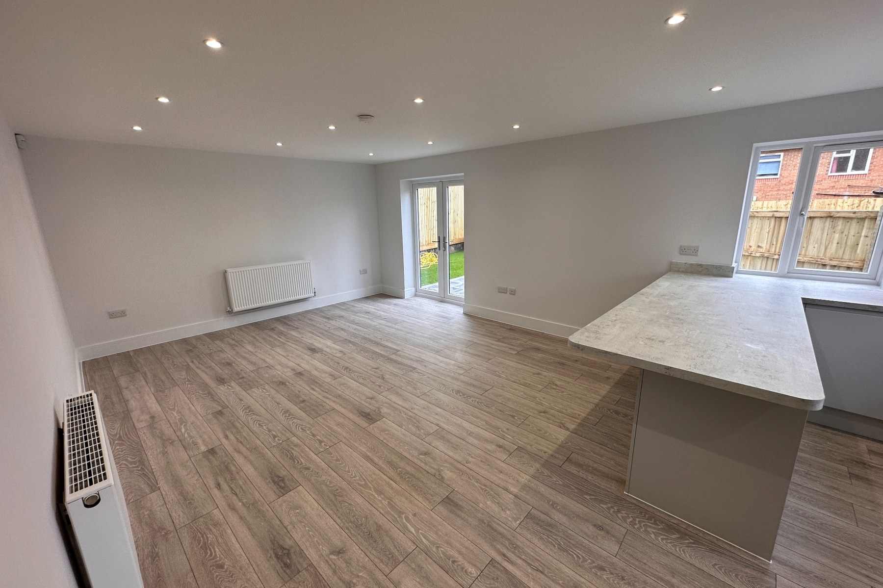 Living space with French doors to the garden.