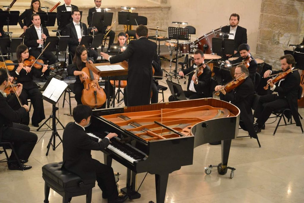 Orchestral performance with grand piano