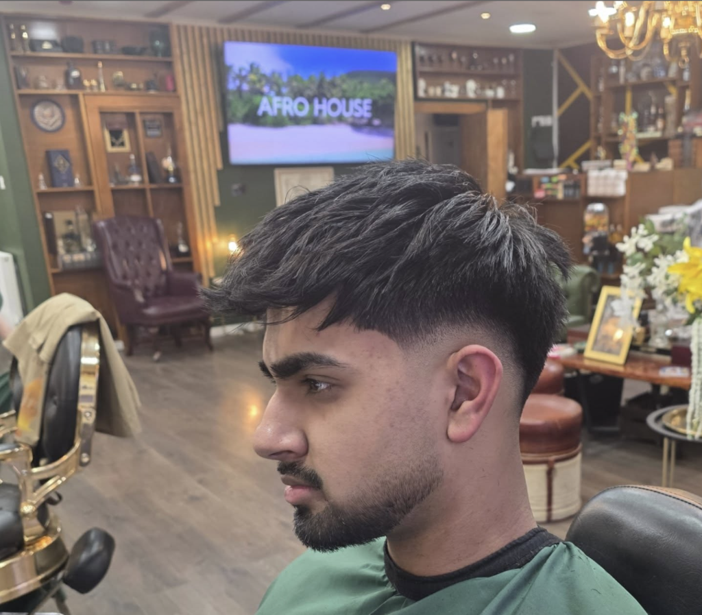 Skin fade with textured top at VIP Cut Barber Newton Mearns