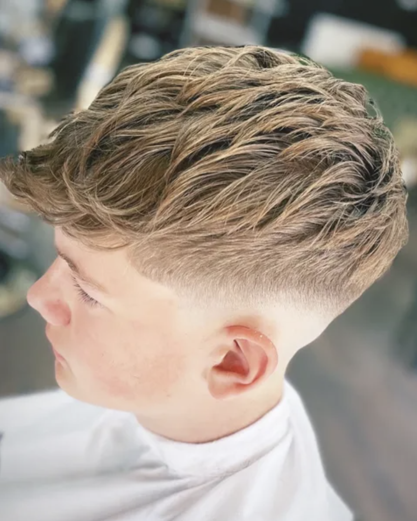 Textured haircut with sharp skin fade — precision barbering at VIP Cut Barber Newton Mearns
