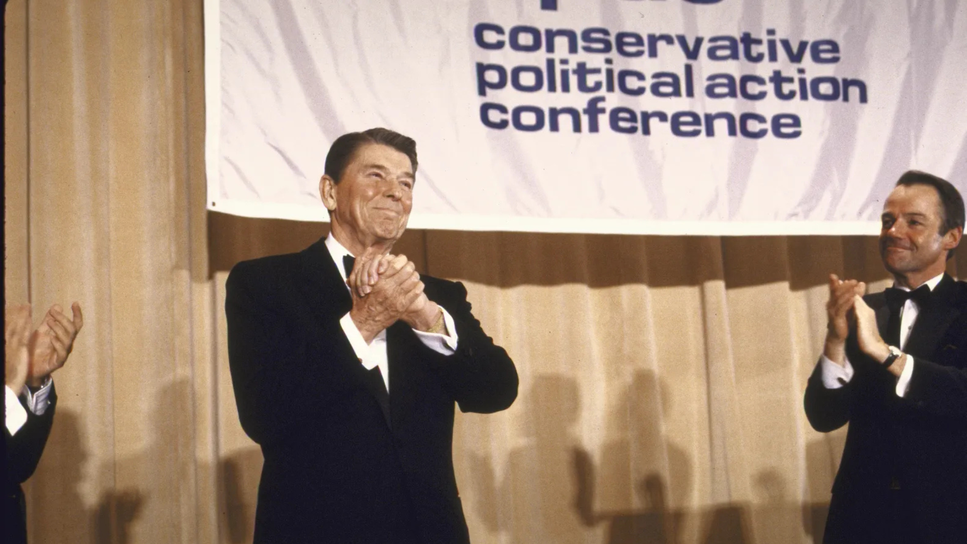 A statesman addressing a political conference in the 1970s