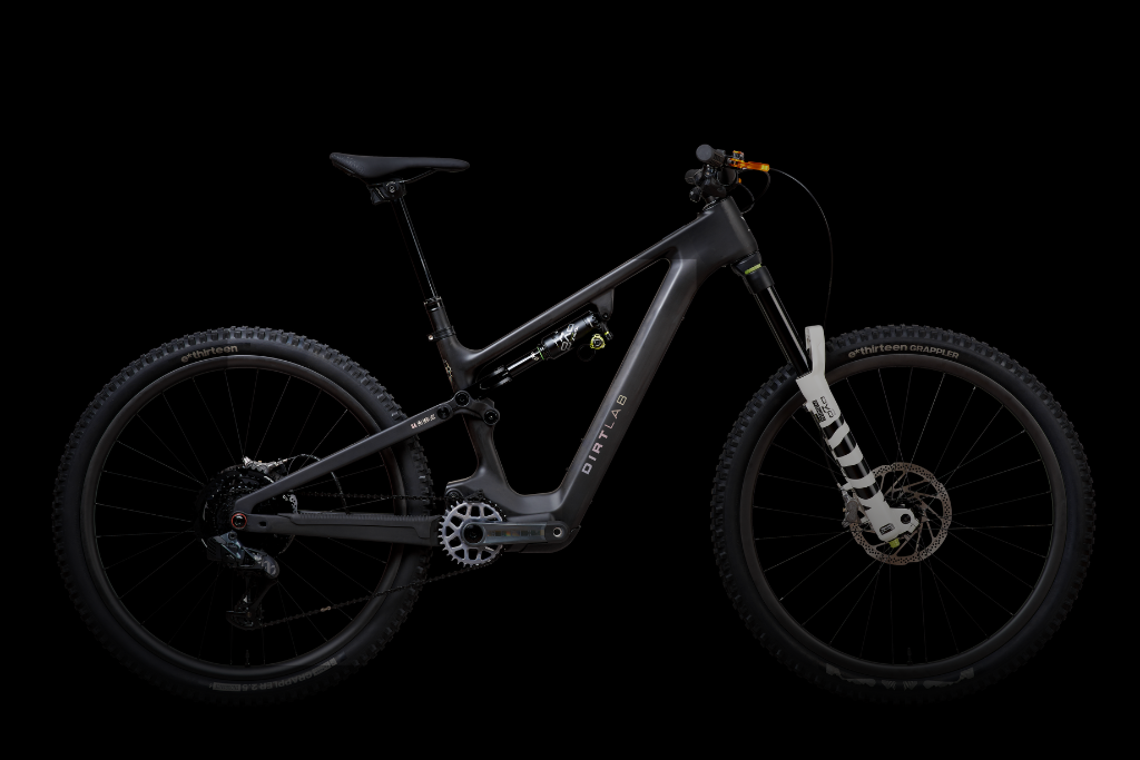 High-end eMTB motor and frame detail in dramatic chiaroscuro lighting