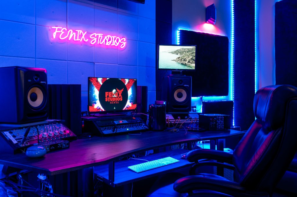 Fenix Studios Recording Suite control room with neon sign and mixing console
