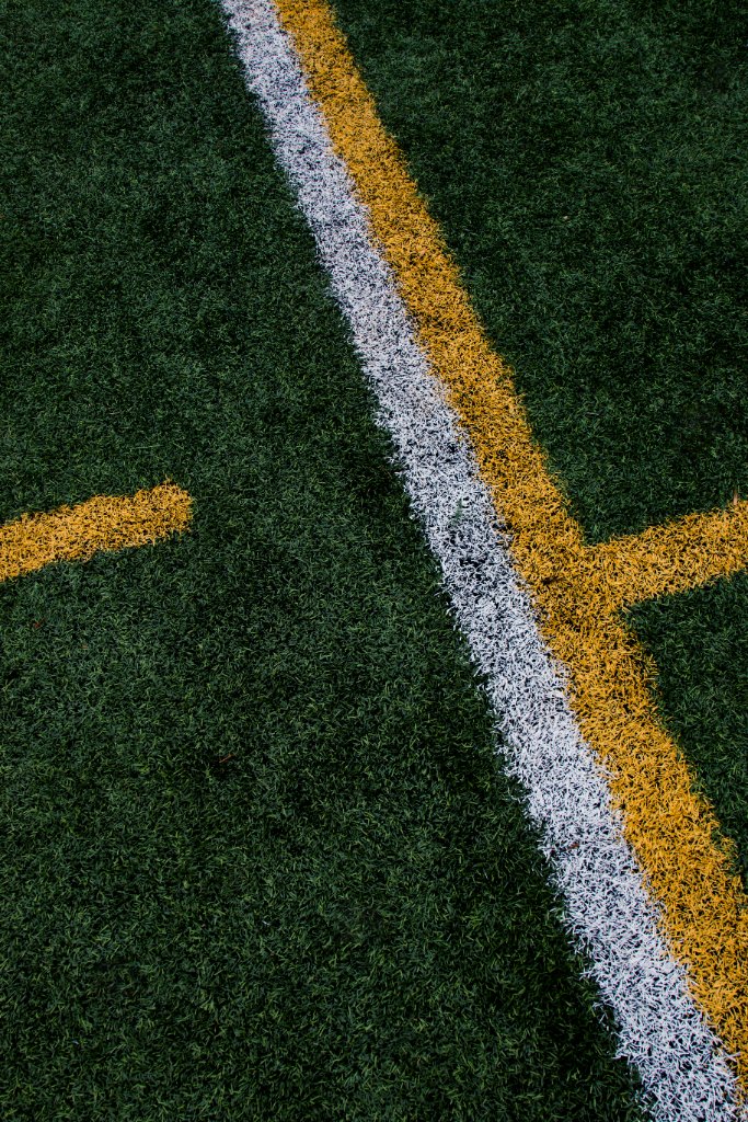 Athletic field turf with yard line markings