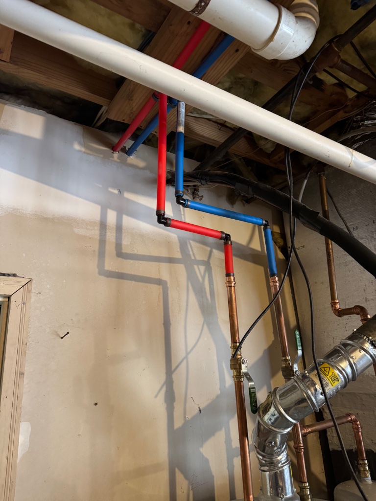 Water lines routed with a minimum 18-inch clearance for the gas water heater