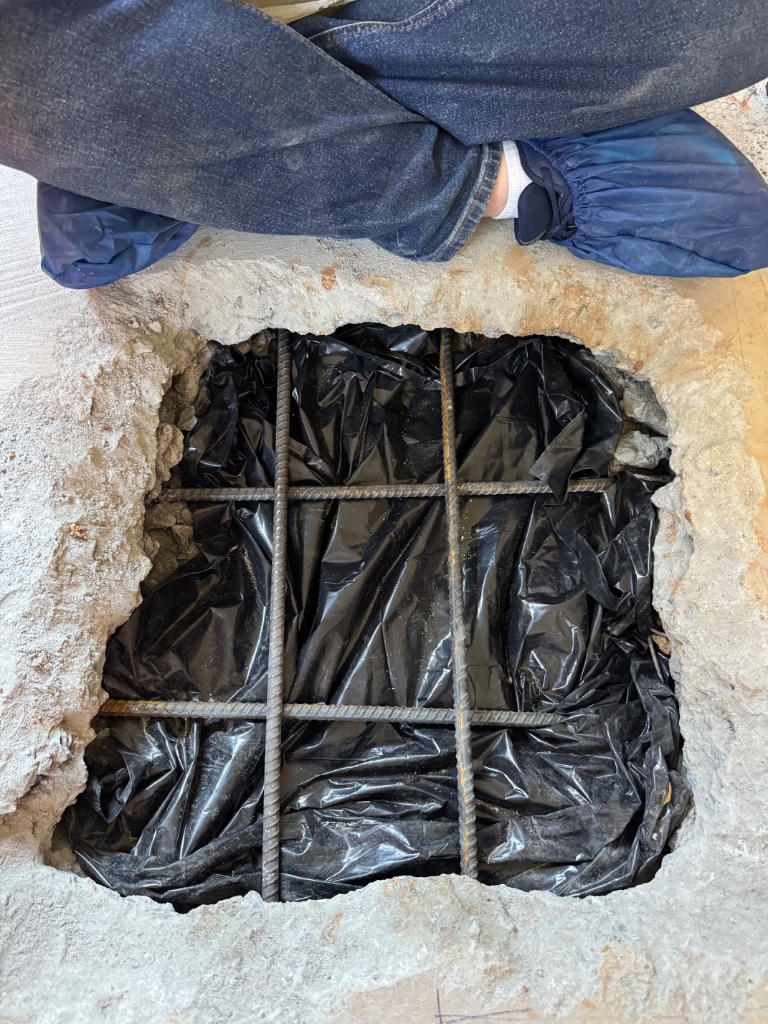 Vapor barrier and rebar laid for the patch