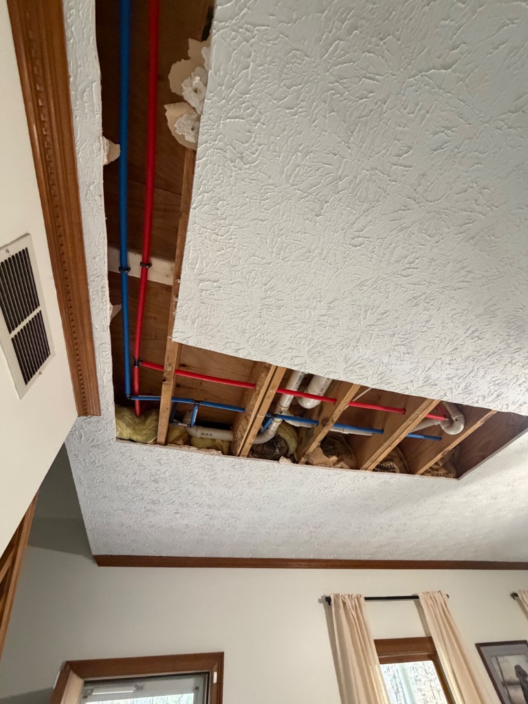 New PEX-B runs routed across ceiling joists
