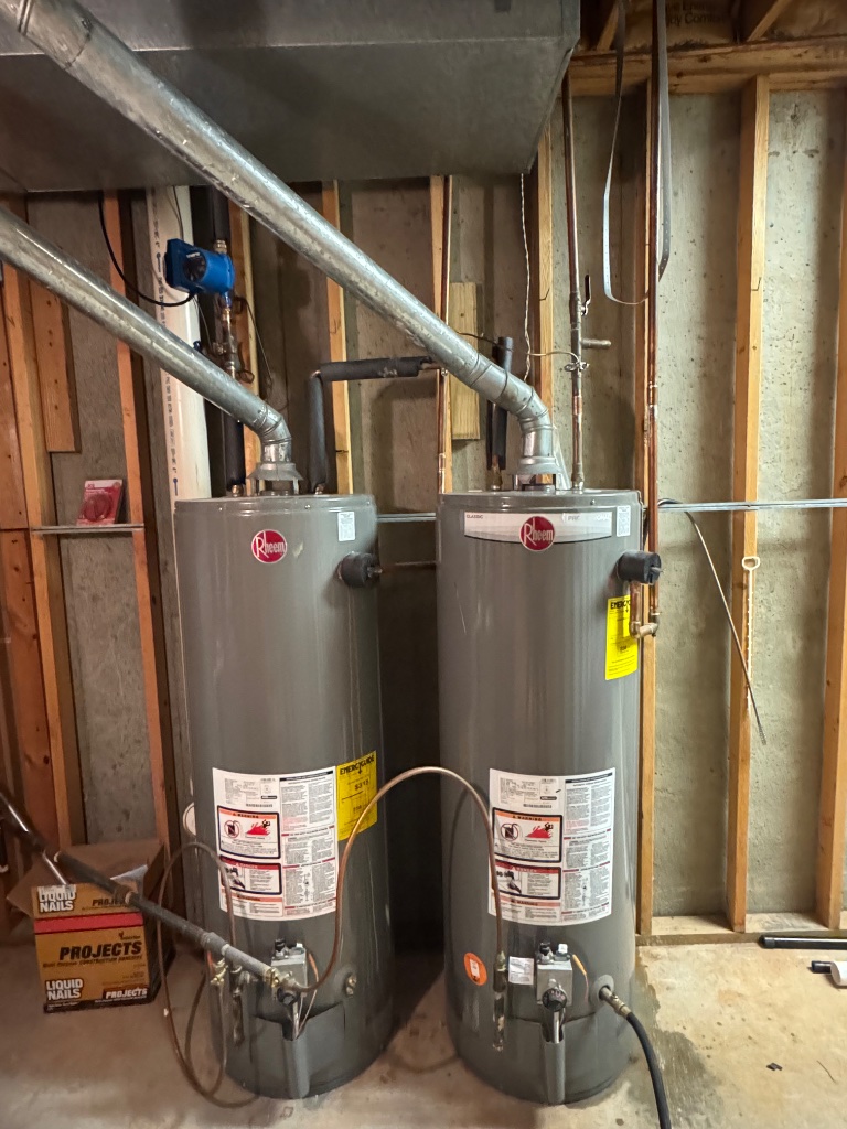 Before: two 50-gallon Rheem gas water heaters piped in series